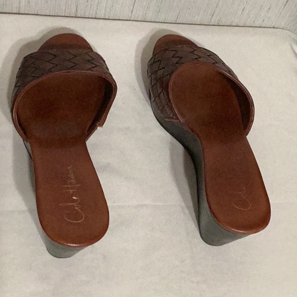 Cole Haan clogs.